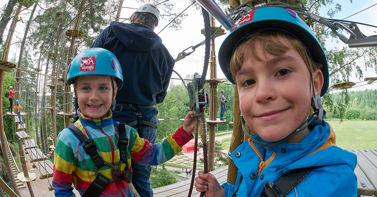The boys have boldly reached the upper platform at Treetop Adventure Huippu.